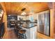 Modern kitchen with an island, stainless steel appliances, and wood cabinets at 8850 W State Road 46, Columbus, IN 47201