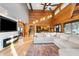 Bright living room with high ceilings, exposed beams, and a large sectional sofa at 8850 W State Road 46, Columbus, IN 47201