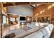 L-shaped sectional sofa in living room with wood beams and walls at 8850 W State Road 46, Columbus, IN 47201