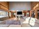 Sunlit living room with a sectional sofa, a built-in fireplace and large windows at 8850 W State Road 46, Columbus, IN 47201