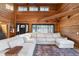 Living room with large windows and a sectional sofa, showcasing natural light at 8850 W State Road 46, Columbus, IN 47201