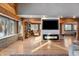 Spacious living area with a fireplace and built-in shelving at 8850 W State Road 46, Columbus, IN 47201