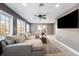 Bright living room featuring a sectional sofa and large TV at 8850 W State Road 46, Columbus, IN 47201