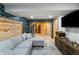 Finished basement playroom with sectional sofa and storage at 8850 W State Road 46, Columbus, IN 47201