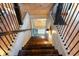 Elegant wooden staircase leading to the lower level at 8850 W State Road 46, Columbus, IN 47201