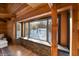 Built-in window seat with stonework below, overlooking snowy landscape at 8850 W State Road 46, Columbus, IN 47201