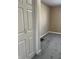 Bedroom with gray carpeting and striped wallpaper accent wall at 1005 S Holmes Ave, Indianapolis, IN 46221