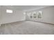 Large bedroom with neutral carpeting and multiple windows at 1011 Grassy Branch Dr, Indianapolis, IN 46239