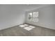 Bright bedroom with carpet and two windows at 1011 Grassy Branch Dr, Indianapolis, IN 46239