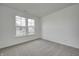 Spacious bedroom with carpet flooring and large window at 1011 Grassy Branch Dr, Indianapolis, IN 46239