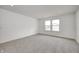 Bright bedroom with grey carpet and double windows at 1011 Grassy Branch Dr, Indianapolis, IN 46239