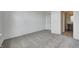 Spacious bedroom with grey carpeting and an ensuite bathroom at 1011 Grassy Branch Dr, Indianapolis, IN 46239