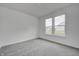 Spacious bedroom with carpet flooring and large window at 1011 Grassy Branch Dr, Indianapolis, IN 46239