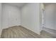 Bright entryway with wood-look flooring and access to other rooms at 1011 Grassy Branch Dr, Indianapolis, IN 46239