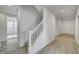 Bright entryway with hardwood floors and staircase at 1011 Grassy Branch Dr, Indianapolis, IN 46239