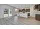 Modern kitchen with island and sliding glass door to patio at 1011 Grassy Branch Dr, Indianapolis, IN 46239