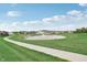 Landscaped pond with fountain and walking path in Highlands at Grassy Creek at 1011 Grassy Branch Dr, Indianapolis, IN 46239