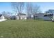 Spacious backyard with lush grass, trees, and a storage shed at 10229 Canal Way, Noblesville, IN 46060