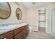 Bathroom with a vanity with double sinks, a toilet, and a walk-in shower at 10229 Canal Way, Noblesville, IN 46060