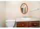 Traditional bathroom with oval mirror, single sink vanity, and toilet at 10229 Canal Way, Noblesville, IN 46060