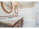 Bright bathroom featuring double sinks, a bathtub, and neutral flooring at 10229 Canal Way, Noblesville, IN 46060