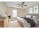 Bedroom with a queen bed, fan, and a dresser at 10229 Canal Way, Noblesville, IN 46060