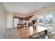 Bright kitchen features a large island with seating, wood cabinets, and access to the outdoor patio at 10229 Canal Way, Noblesville, IN 46060