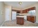 Functional kitchen with a center island, ample cabinet space, and neutral-colored flooring at 10229 Canal Way, Noblesville, IN 46060
