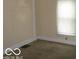 Small bedroom with neutral walls and carpeted floor at 1053 W 35Th St, Indianapolis, IN 46208