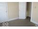 Bedroom with white doors and carpeted floor at 1053 W 35Th St, Indianapolis, IN 46208