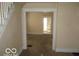 Living room with view of the front door and staircase at 1053 W 35Th St, Indianapolis, IN 46208