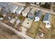 An aerial view shows the property featuring a well-maintained yard and neighboring houses at 1130 S Senate Ave, Indianapolis, IN 46225