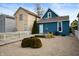 Backyard with pea gravel, partial fence, small deck, and a view of the home's exterior at 1130 S Senate Ave, Indianapolis, IN 46225