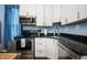 Detailed view of the kitchen featuring stainless steel appliances and granite countertops at 1130 S Senate Ave, Indianapolis, IN 46225