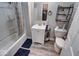 Clean bathroom with a shower/tub combo and vinyl flooring at 117 N Sheffield Ave, Indianapolis, IN 46222