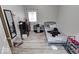 Cozy bedroom with a full-size bed and vinyl flooring at 117 N Sheffield Ave, Indianapolis, IN 46222