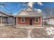 Charming orange bungalow with a front porch at 117 N Sheffield Ave, Indianapolis, IN 46222