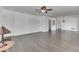 Bright living room with hardwood floors and ceiling fan at 121 W Wind Chime Cir, Greenwood, IN 46143