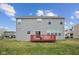 Spacious backyard featuring a red wood deck and vinyl siding at 1284 Jesse Ct, Greenwood, IN 46143