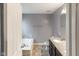 Spacious bathroom featuring a soaking tub, a separate toilet, and a vanity with granite countertops at 1284 Jesse Ct, Greenwood, IN 46143