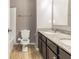 Bathroom featuring a dual sink vanity with granite countertop and tile flooring at 1284 Jesse Ct, Greenwood, IN 46143