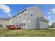 View of the home's rear exterior featuring vinyl siding and a red deck at 1284 Jesse Ct, Greenwood, IN 46143