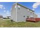 View of the home's rear exterior featuring vinyl siding and a red deck at 1284 Jesse Ct, Greenwood, IN 46143