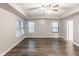 Spacious main bedroom featuring hardwood floors and large windows with trey ceiling and ceiling fan at 1284 Jesse Ct, Greenwood, IN 46143