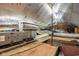 View of the attic with insulation, HVAC equipment, and exposed wooden beams at 1468 Alabama St, Indianapolis, IN 46202