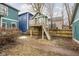 Backyard image of a charming treehouse with swings and slide at 1468 Alabama St, Indianapolis, IN 46202