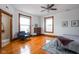 Bright bedroom featuring hardwood floors, natural light, and classic wood trim at 1468 Alabama St, Indianapolis, IN 46202