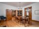 Elegant dining room with original hardwood floors, traditional chandelier, and charming pocket doors at 1468 Alabama St, Indianapolis, IN 46202