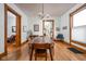 Bright dining room with hardwood floors, traditional chandelier, and ample natural light at 1468 Alabama St, Indianapolis, IN 46202