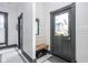 Cozy entryway with a bench, mirror, and tile flooring, offering a welcoming transition space at 1468 Alabama St, Indianapolis, IN 46202